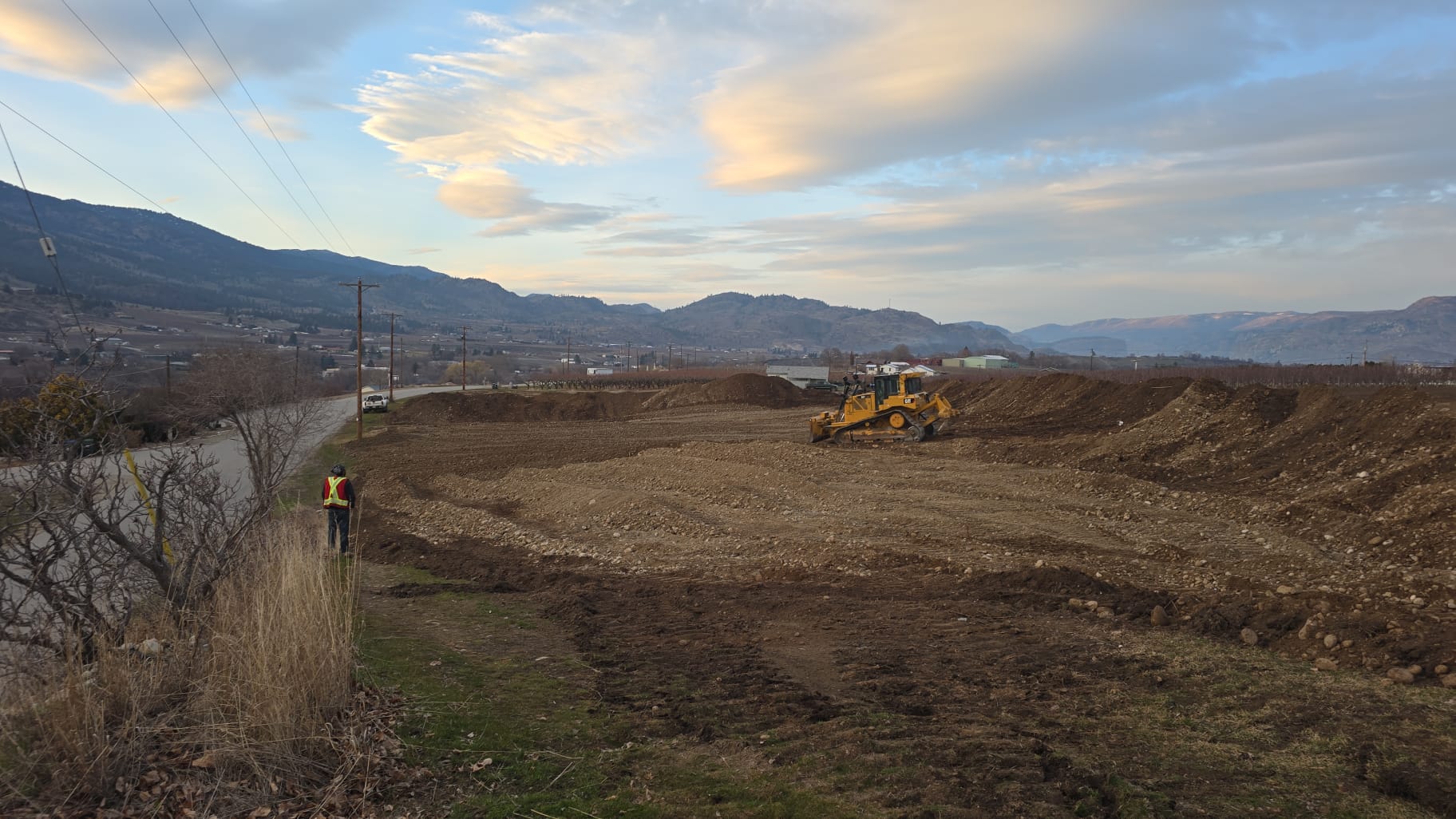 Large scale earth moving operation at dusk in South Okanagan